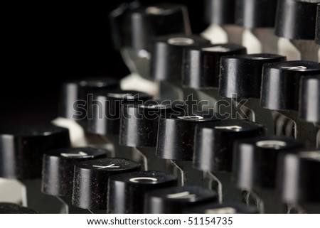 Macro of manual typewriter on black isolated background