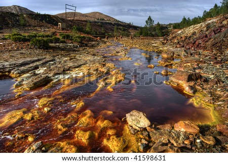 riotinto river with red waters produced by the copper mining