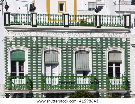 green Spanish balcony in a village of Andalusia