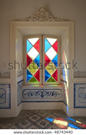 stained-glass window in a small room in a Portuguese palace