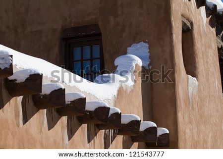 Snow piles up on Santa Fe\'s vigas in winter