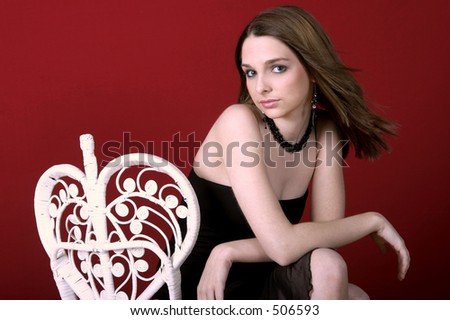 Young woman posed on chair