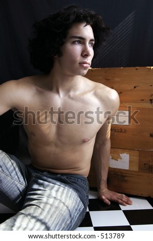 College age man with shirt off