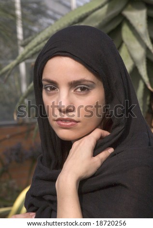 stock-photo-portrait-style-shot-of-a-beautiful-woman-wearing-a-headscarf-or-hijab-18720256.jpg
