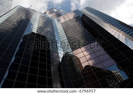 A view looking up at a skyscraper in the financial district of Chicago.