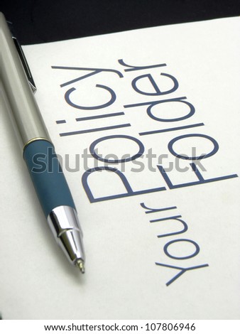 Image showing text policy Folder with pen on isolated white background.