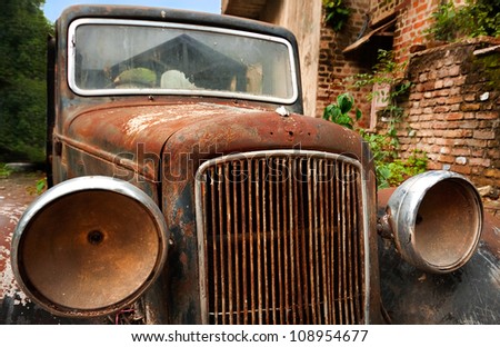 Old abandoned vintage car.