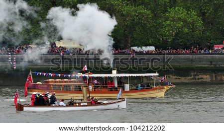 LONDON - JUNE 3rd 2012: Steam powered boats take part in Queen Elizabeth Diamond Jubilee River Pageant on June 3rd 2012 in London