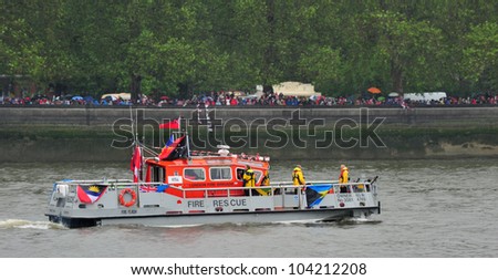 LONDON - JUNE 3rd 2012: An emergency services boat takes part in Queen Elizabeth Diamond Jubilee River Pageant on June 3rd 2012 in London
