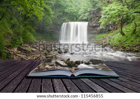 Creative composite image of waterfall in woods in pages of magic book