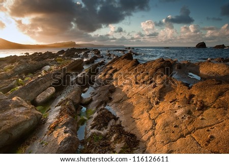 Beautiful sunrise landscape over Mupe Bay on Jurassic Coast in Dorset, England