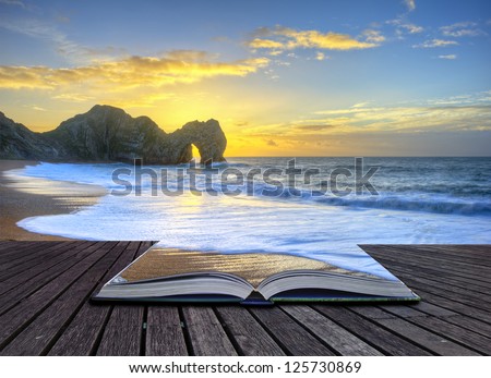 Creative concept image of sunrise over ocean with rock stack in foreground