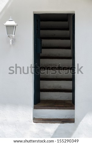 Fine art image of Mediterranean style door with stairs leading inside