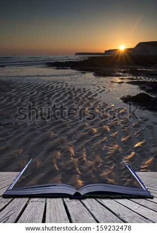 Creative concept pages of book Landscape image of rocky beach at sunset with long exposure motion blur sea