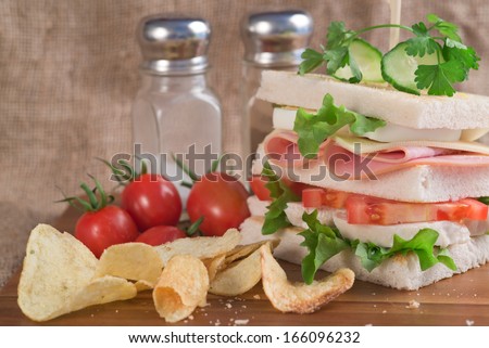 Rustic kitchen setting for fresh club sandwich