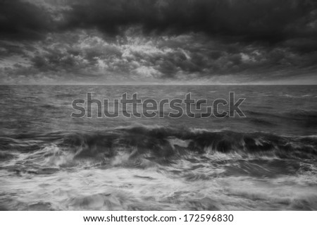 Waves breaking under stormy Winter sky