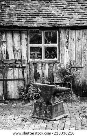 Black and white landscape of old blacksmiths workshop in Victorian era