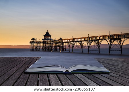 Stunning long exposure sunset over ocean with pier silhouette conceptual book image