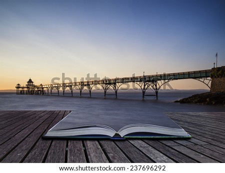 Stunning long exposure sunset over ocean with pier silhouette conceptual book image
