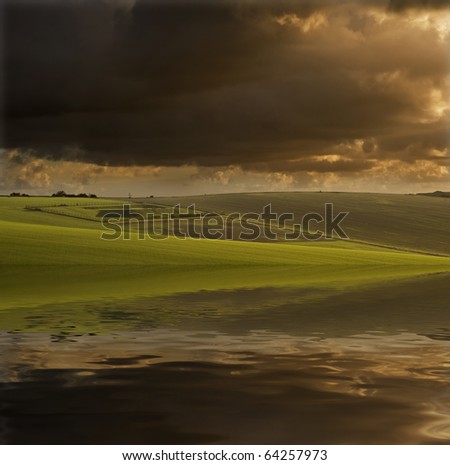 Beautiful stormy English landscape reflected in digitally created water