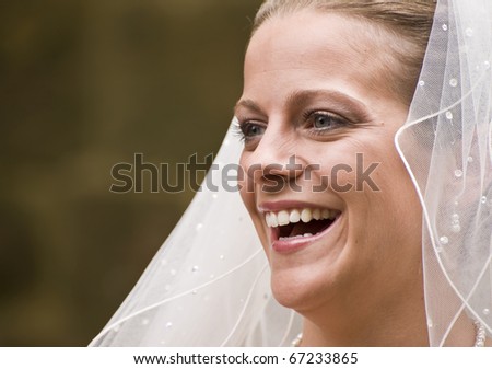 Close up portrait of attractive young bride happy and smiling naturally