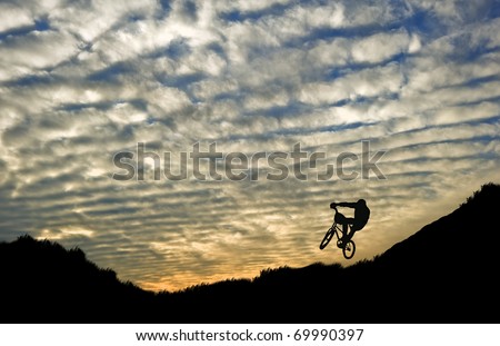 Extreme sports bike trials silhouette against beautiful sunset
