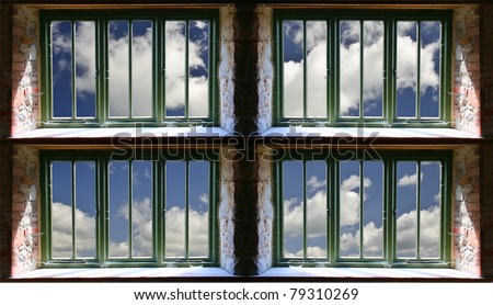 Beautiful blue sky viewed through old grungy windows, creative concept idea of new beginnings and fresh start