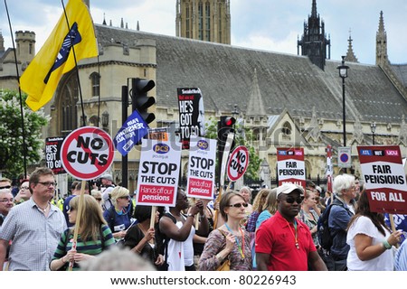 LONDON - JUNE 30; Unidentified members of trade unions demonstrate their protest against government cuts during a demonstration  organised by PCS and NUT trade unions in London on June 30, 2011