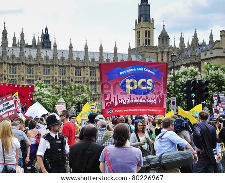 LONDON - JUNE 30; Unidentified PCS union members demonstrate outside parliament during a strike and demonstration  organised by the trade union in London on June 30, 2011