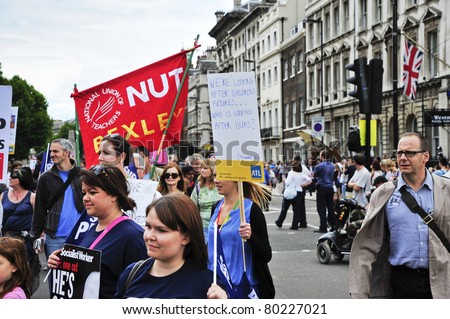 LONDON - JUNE 30; Unidentified teachers and civil servants demonstrate against proposed spending cuts during a demonstration  organised by various trade unions in London on June 30, 2011