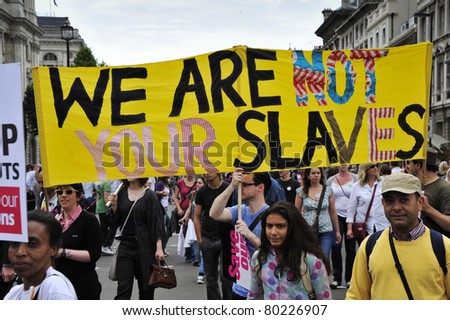 LONDON - JUNE 30; Unidentified protesters display a message during a trade union strike demonstration against proposed spending cuts during a march organised by trade unions in London on June 30, 2011