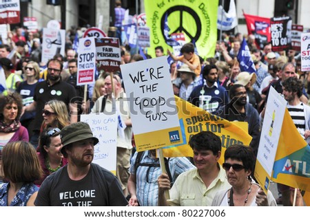 LONDON - JUNE 30; Unidentified members of various trade unions march in protest against spending cuts during a march organised by teachers and civil servants trade unions in London on June 30, 2011