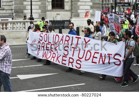 LONDON - JUNE 30; Unidentified members of the Greek London community show their support against cuts proposed by the government during a march organised by trade unions in London on June 30, 2011