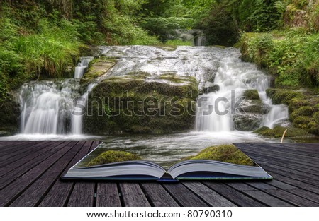 Creative concept image of flowing forest waterfall coming out of pages in magical book