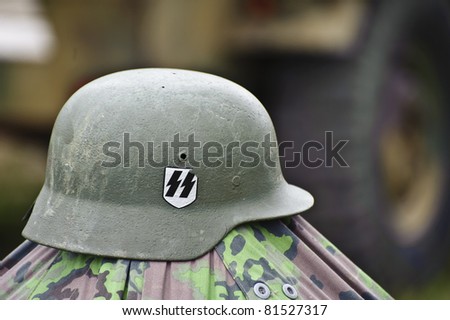 LONDON - JULY 21 - WW2 German SS military helmet during reenactment at War and Peace Show, world\'s largest military show, on July 21st, 2011 near London, England