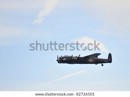 EASTBOURNE, ENGLAND - AUGUST 12 - World War Two operational and rare British Lancaster Bomber at annual International Airshow on 12th August 2011 at Eastbourne in England