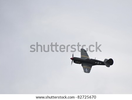 EASTBOURNE, ENGLAND - AUGUST 12 - American World War Two P40 Kitty Hawk in flight at annual International Airshow on 12th August 2011 at Eastbourne in England