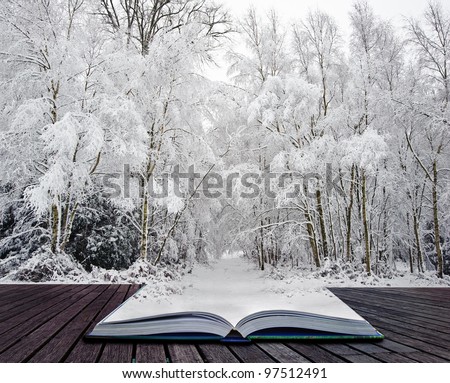 Beautiful landscape of glistening frost and snow covered trees coming out of pages in magic book