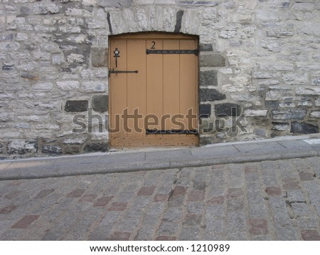 Door on down sloping street