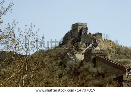 Tourist  climbing up the stairs to the watch tower on the Great Wall of  China