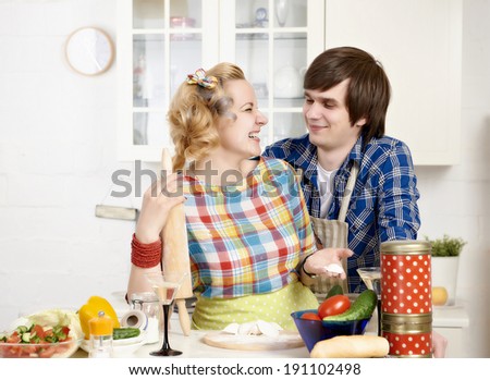 Portrait of a young couple preparing meat dumplings