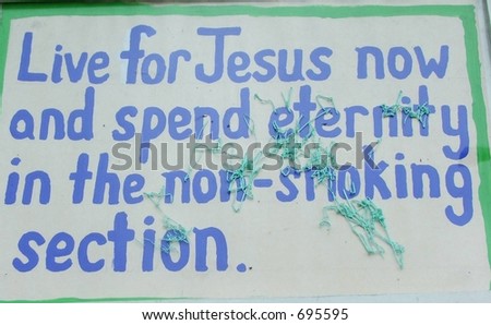 Religious sign with spray vandalism