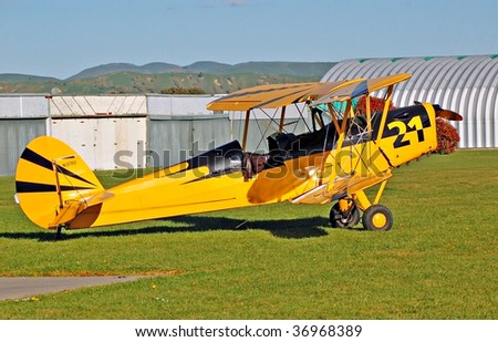 Yellow vintage biplane at Hood aerofrome, Masterton, New Zealand