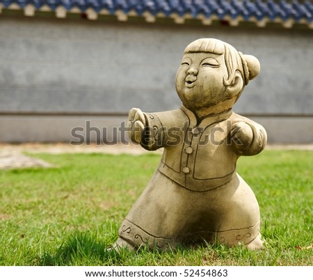 Funny traditional Thai garden sculpture. Demonstrating military art.
