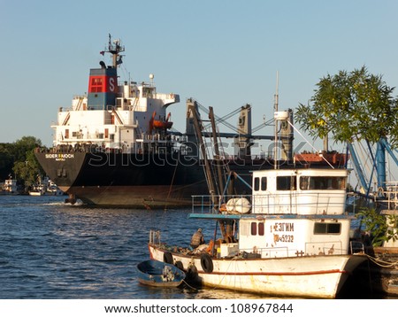 VARNA, BULGARIA - JULY 21: Bulk carrier SIDER FAIOCH, Flag: Italy, Year Built: 1986,  sails into open sea on July 21, 2012 in Varna, Bulgaria. Ship`s next destination is Taman, Russia.