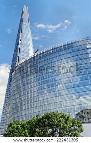 LONDON, UK - JULY 1, 2014: The Shard (Architect Renzo Piano, 2012) - tallest building in European Union. The Glass-clad pyramidal tower (310 m tall) has 72 habitable floors.