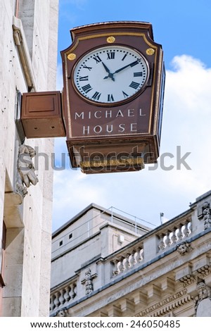 LONDON - JULY 1, 2014: The wall mounted clock at the Michael house showing ten minutes past eleven.
