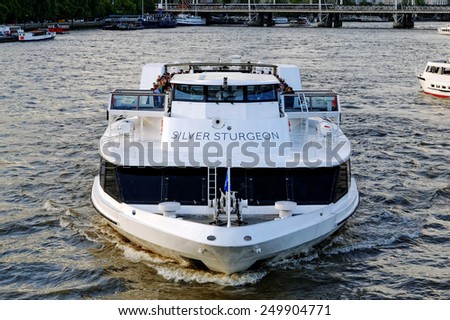 LONDON, ENGLAND - JULY 1, 2014 The Thames river cruise boat \
