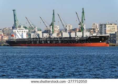 VARNA, BULGARIA - APRIL 04, 2015: Bulk carrier AFRICAN TEIST (IMO: 9655420) from Japan, Built: 2014, Flag: Panama, is unloading gas pipes at Port of Varna.