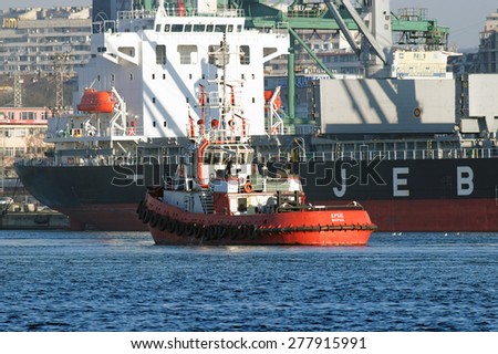 VARNA, BULGARIA - APRIL 04, 2015: Bulk carrier AFRICAN TEIST (IMO: 9655420) from Japan, Built: 2014, Flag: Panama, is unloading gas pipes at Port of Varna.